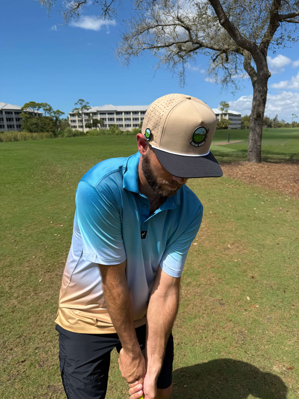 Logie Joe's Golf hunting birdies snapback hat with magnetic ball marker holder, adjustable tan and black, featuring built-in golf accessories.