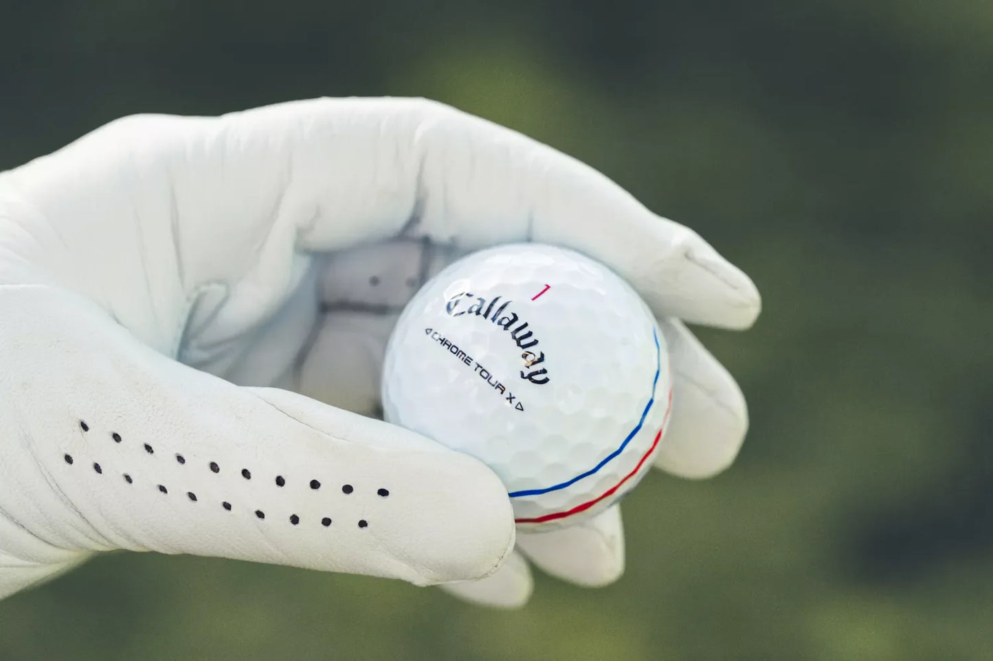 Callaway 2024 Chrome Tour X Triple Track golf balls with bright white surface and Triple Track alignment markings.