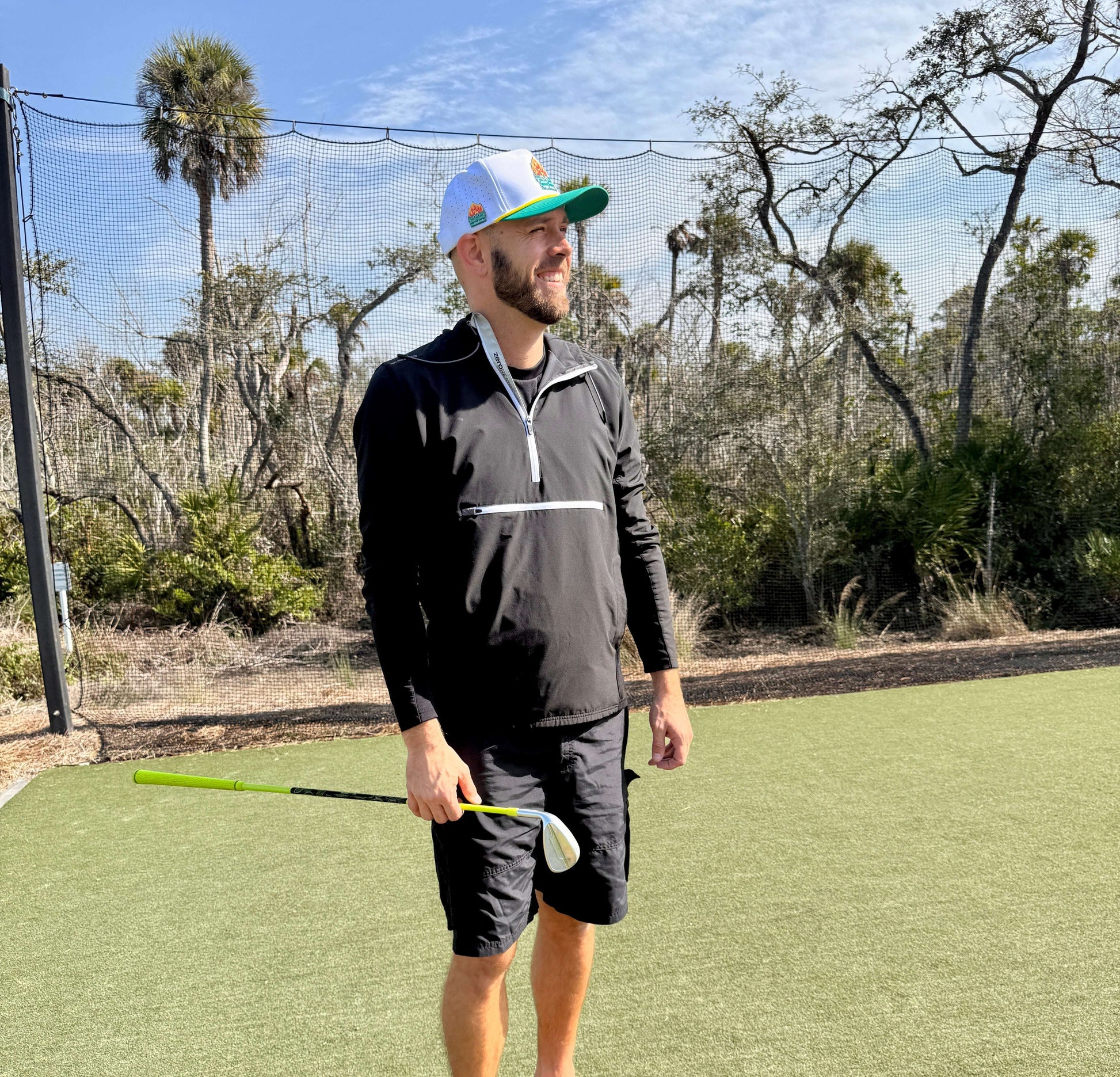 White and teal Dumpster Fire golf hat by Logie Joe's Golf, adjustable snapback cap with magnetic ball marker holder and marker.