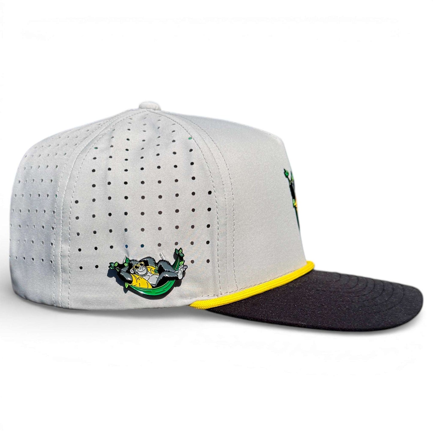 Logie Joe's Golf Banana Hammock snapback hat with built-in magnetic ball marker holder, adjustable strap, and included marker.