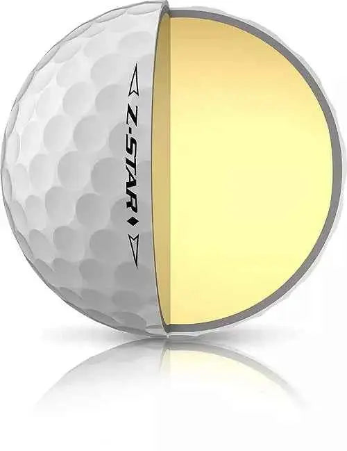 Srixon 2023 Z-STAR Diamond golf balls in white with black and gold branding, arranged in a display on a golf course.